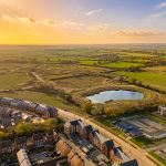 Aerial view of countryside at sunset.