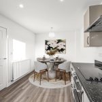 Modern kitchen with dining table and chairs