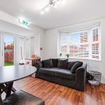 Modern living room with sofa and dining table.