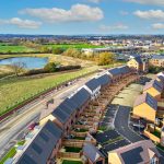 Aerial view of modern housing estate and landscape.