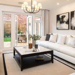 Modern living room with white sofa and artworks