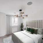 Modern bedroom with grey decor and green pillows