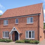 Red-brick house with garage and garden
