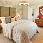 Modern bedroom with stylish decor and cosy bedding.