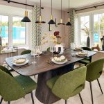 Modern dining room with green chairs and decor.