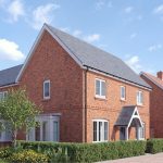 Modern red-brick house with garden and hedges