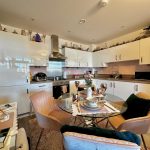 Modern kitchen with dining table and chairs