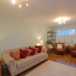 Cosy living room with sofa and chairs