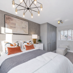 Modern bedroom with grey decor and chandelier
