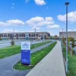Entrance to Watling Academy, modern buildings and pathways.