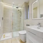 Modern bathroom with glass shower enclosure and sink