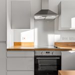 Modern kitchen with stainless steel cooker