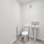 Modern minimalist bathroom with toilet and sink