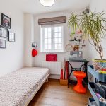 Cosy bedroom with sewing machine and decor