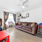 Cosy living room with sofa and TV