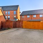 Modern brick houses with fenced courtyard