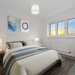 Modern bedroom with sunset view and stylish decor.