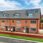 Modern brick terraced houses with solar panels.