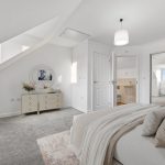 Modern, bright bedroom with ensuite bathroom.