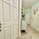 Cosy hallway with doors and decor.