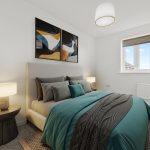 Modern bedroom with teal bedding and artwork.