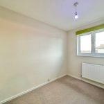 Empty room with window and radiator