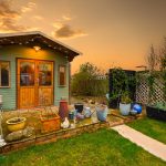 Garden shed with plants at sunset