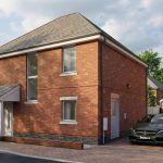 Modern brick house with driveway and car.