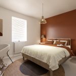 Modern bedroom with rustic decor and warm colours.