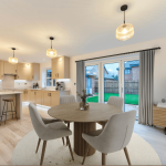Modern kitchen and dining area with natural light.
